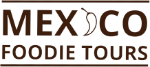 Logo for "Mexico Foodie Tours" with a chili pepper replacing the "I" in "Mexico." The brown text and rectangular border capture the essence of an authentic food tour, promising a true culinary experience.